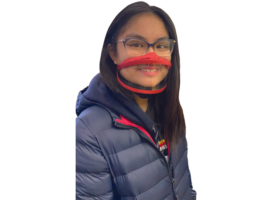 A girl with black long hair, wearing eyeglasses, a navy jacket and a red face mask.